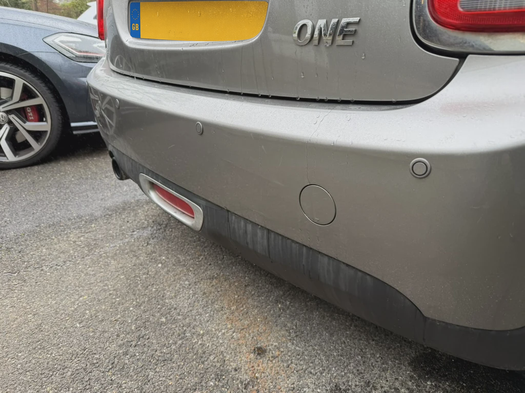 Grey MINI rear bumper with colour-matched parking sensors fitted